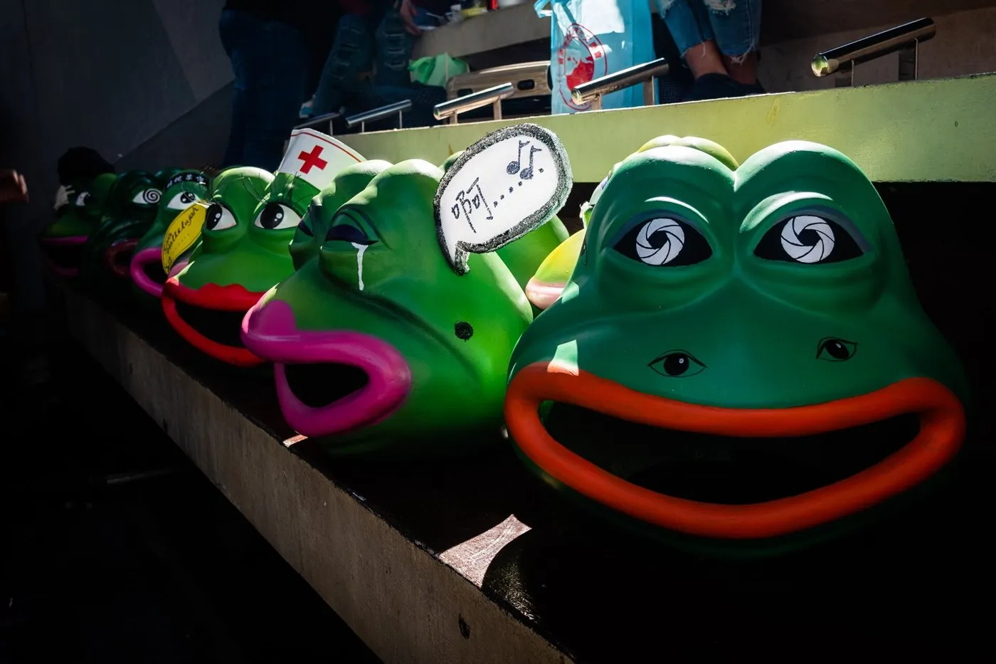 Row of Pepe the Frog masks on a street in Hong Kong, 2019